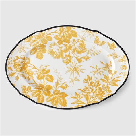 Herbarium oval tray in yellow porcelain .